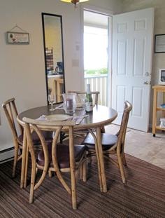 Dining area with rattan chairs and natural light