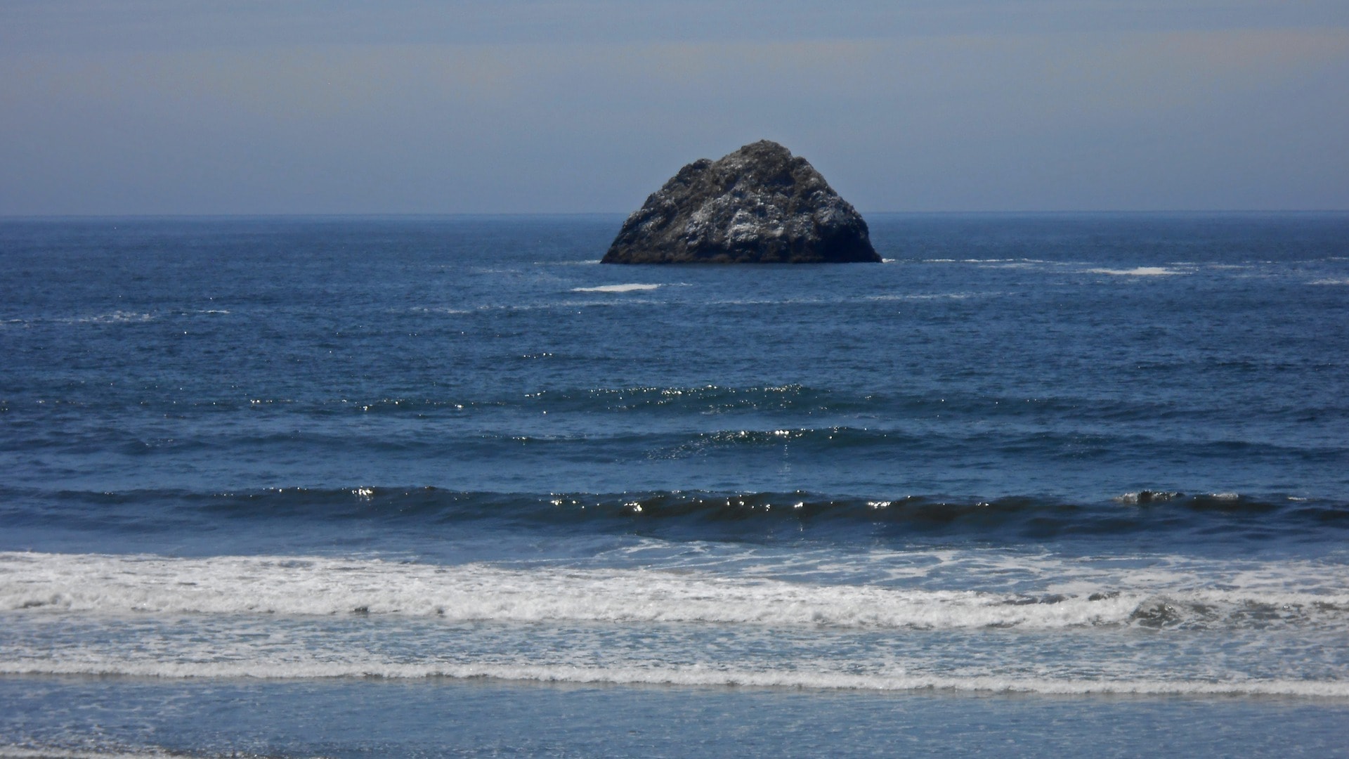Scenic beach with island rock formation